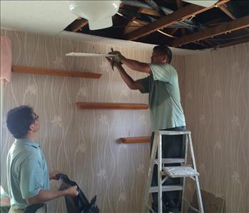 Restoring a house damage by fire, team member at SERVPRO of East Honolulu
